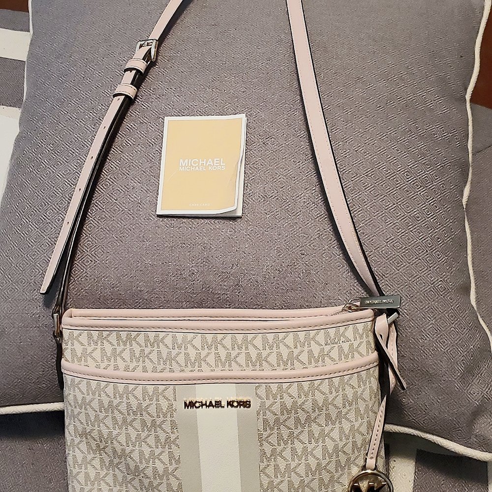 Michael Kors cream and pink purse.. Medium in size